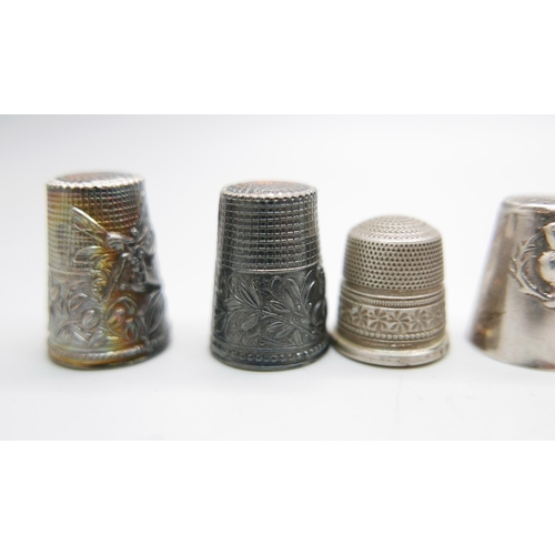 880 - Eight silver thimbles and one other thimble