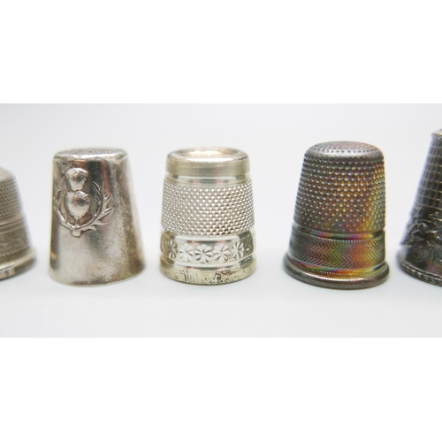 880 - Eight silver thimbles and one other thimble