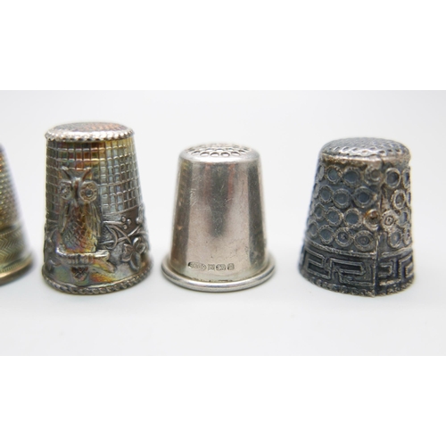 880 - Eight silver thimbles and one other thimble