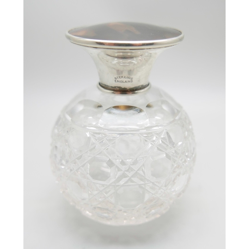 890 - A silver topped globular glass scent bottle