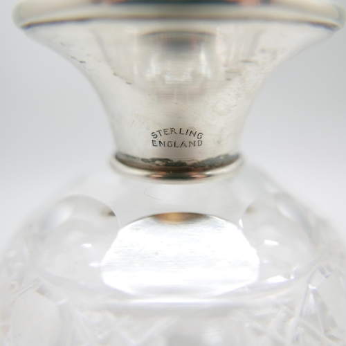 890 - A silver topped globular glass scent bottle