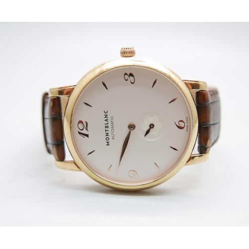 900 - An 18ct gold Mont Blanc automatic wristwatch, model 107076, 7214-PL886928, with box and service guid... 