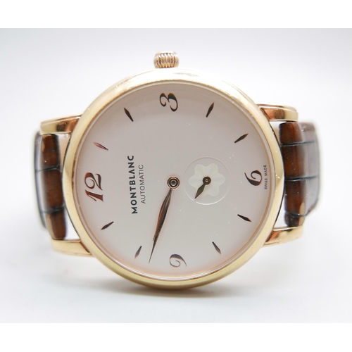 900 - An 18ct gold Mont Blanc automatic wristwatch, model 107076, 7214-PL886928, with box and service guid... 