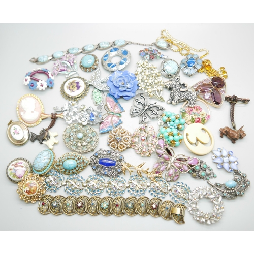 968 - A collection of brooches, a necklet and a bracelet, a early plastic carved celluloid 'dangly' Scotti... 