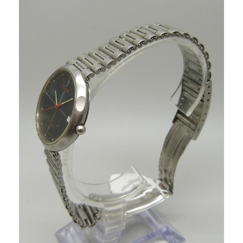 971 - A vintage Tissot Seastar wristwatch with black face and red second sweep hand, with date and origina... 