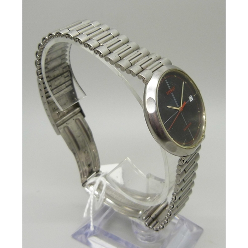 971 - A vintage Tissot Seastar wristwatch with black face and red second sweep hand, with date and origina... 