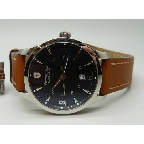 976 - A gentleman's Roamer black faced wristwatch and a gentleman's Victorinox wristwatch