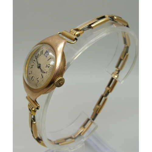 992 - An Art Deco 9ct gold wristwatch on a German made 1/20th 14ct gold bracelet strap