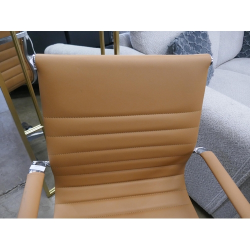 1371 - A Charles and Ray Eames tan desk chair - slight damage