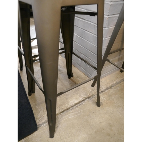 1377 - A pair of Tolix style barstools with a rustic patina