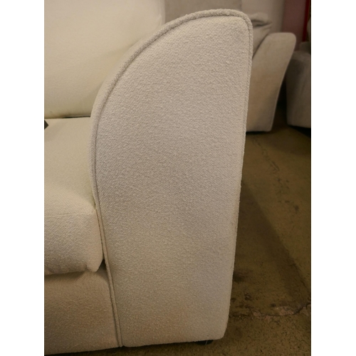 1494 - An off-white upholstered compact corner sofa