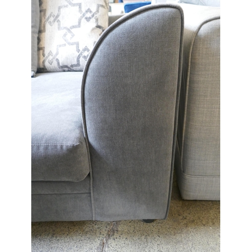 1521 - A grey upholstered three seater sofa