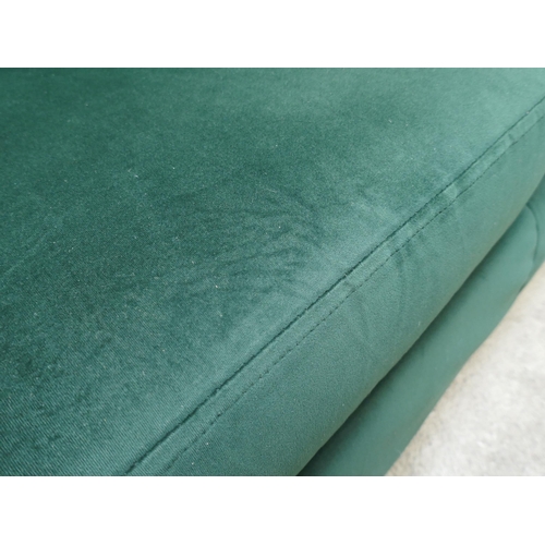 1525 - A green velvet three seater sofa, damaged frame