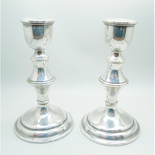 883A - A pair of silver candlesticks, 16.5cm