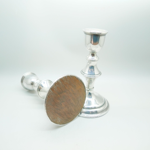 883A - A pair of silver candlesticks, 16.5cm