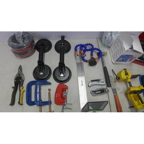 2034 - A box of assorted tools and consumables including G clamps, three Pifco 10m 4 socket extension reels... 