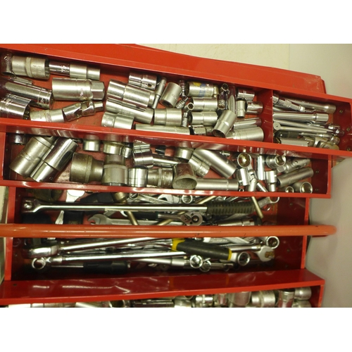 2036 - A red metal cantilever tool box of sockets and spanners