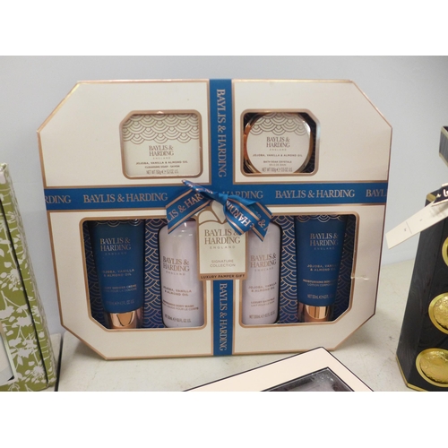 2076 - A box of assorted cosmetics gift sets including Baylis and Harding, Yardley, Next etc.