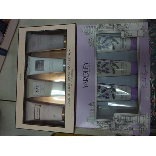 2076 - A box of assorted cosmetics gift sets including Baylis and Harding, Yardley, Next etc.