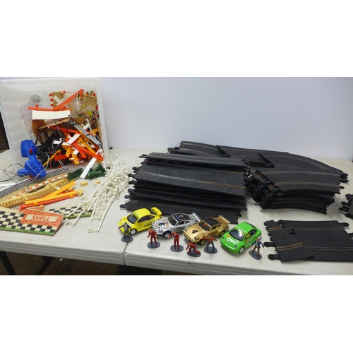 2080 - A large quantity of assorted slot racing and Scalextric track, cars and triggers, etc.