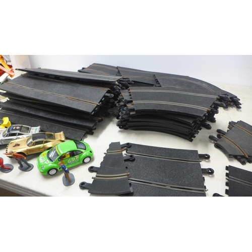 2080 - A large quantity of assorted slot racing and Scalextric track, cars and triggers, etc.