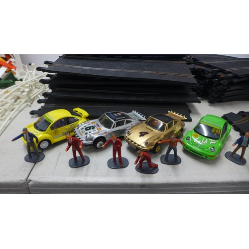 2080 - A large quantity of assorted slot racing and Scalextric track, cars and triggers, etc.