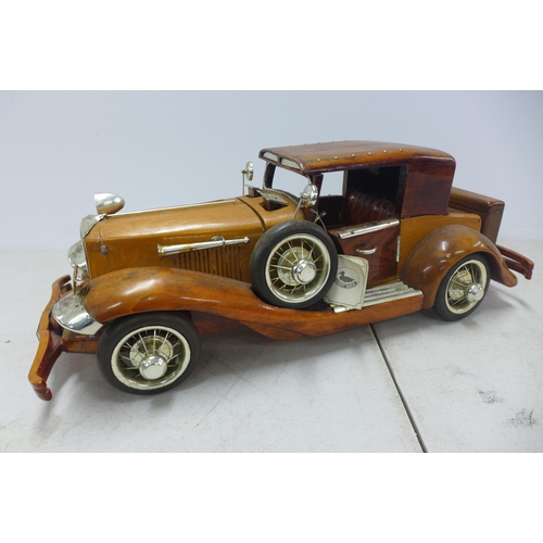 2088 - A wooden model of a vintage car