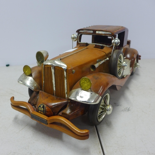 2088 - A wooden model of a vintage car