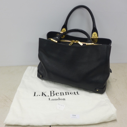 2098 - A black leather L K Bennett handbag with gold detailing and matching dust bag