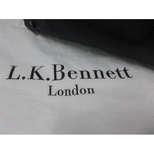 2098 - A black leather L K Bennett handbag with gold detailing and matching dust bag