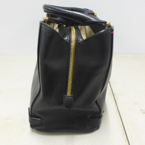 2098 - A black leather L K Bennett handbag with gold detailing and matching dust bag