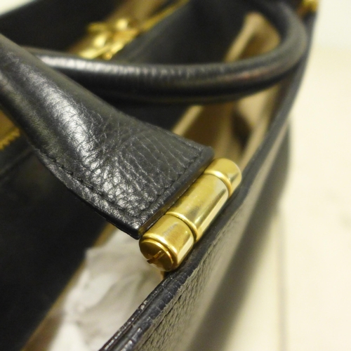 2098 - A black leather L K Bennett handbag with gold detailing and matching dust bag