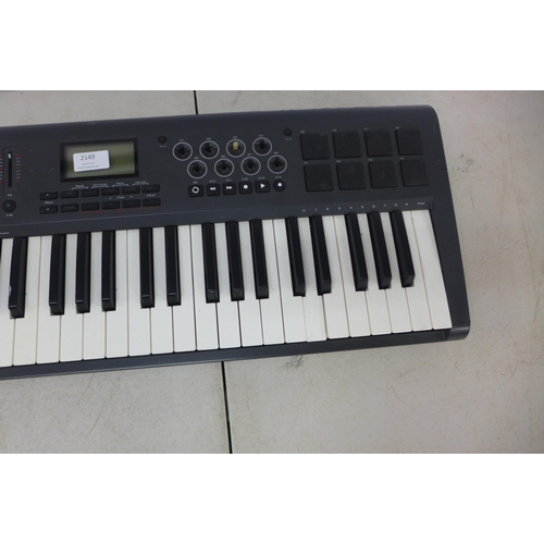 2149 - An M-Audio AX10M 49 49-key midi keyboard and an M-Audio SP-Z Universal sustain pedal