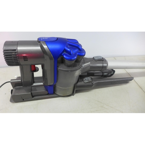 2150 - A Dyson DC35 cordless stick vacuum cleaner with wall mount, charger and two attachments and a Dyson ... 