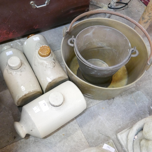 278 - A brass jam pan, a brass bucket and three stone hot water bottles