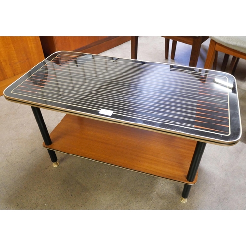 28 - A teak and black laminate Starburst pattern coffee table