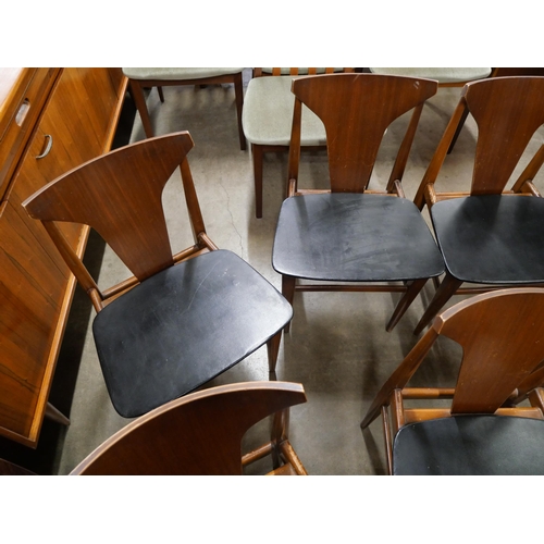 45 - A set of eight teak and black vinyl dining chairs