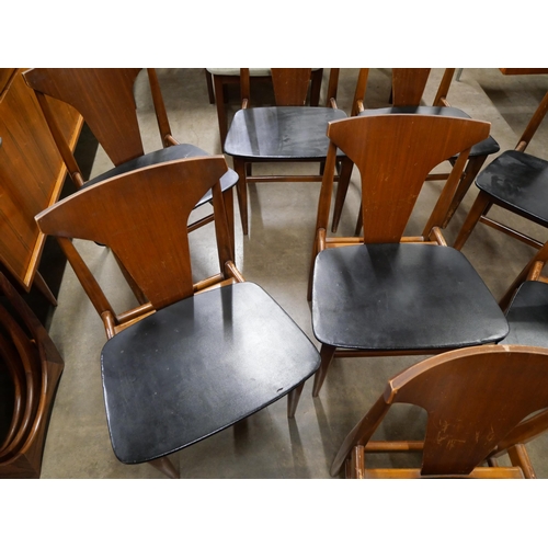 45 - A set of eight teak and black vinyl dining chairs