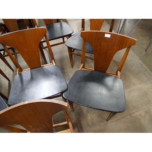 45 - A set of eight teak and black vinyl dining chairs