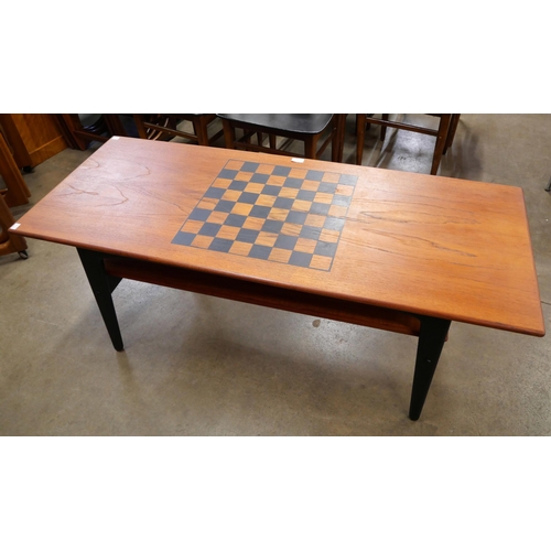 46 - A Danish teak two tier coffee table