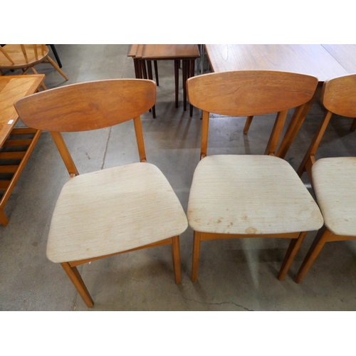 50 - A set of four teak dining chairs