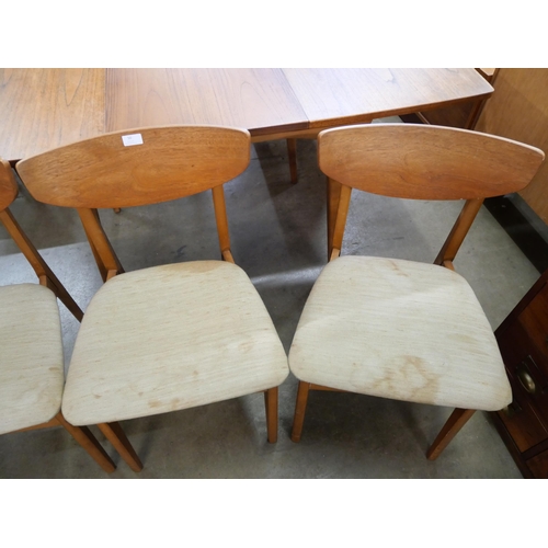 50 - A set of four teak dining chairs