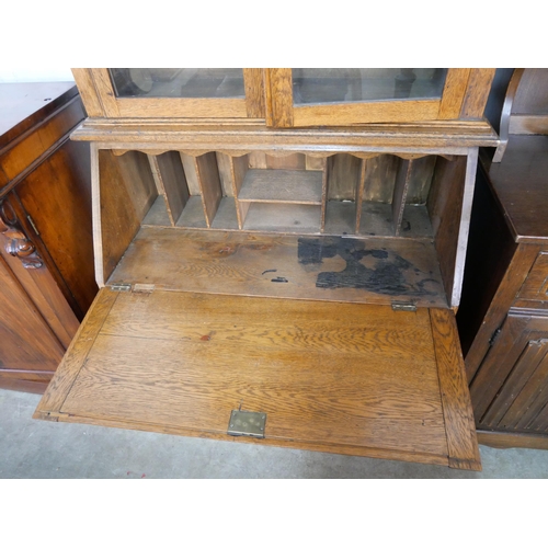 76 - An early 20th Century oak bureau bookcase