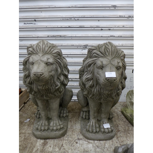 2198 - A pair of stone effect concrete lion garden ornaments - approximately 23