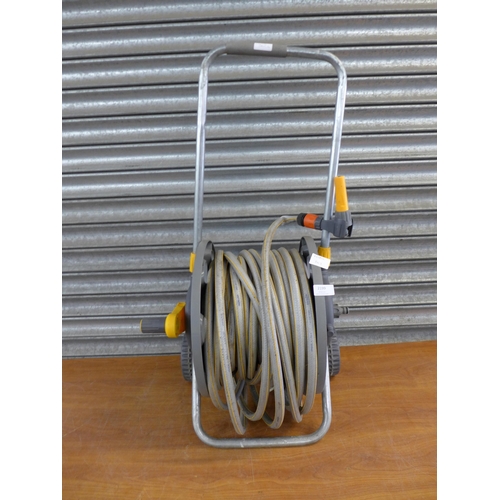 2199 - A Hozelock hose pipe and trolley reel