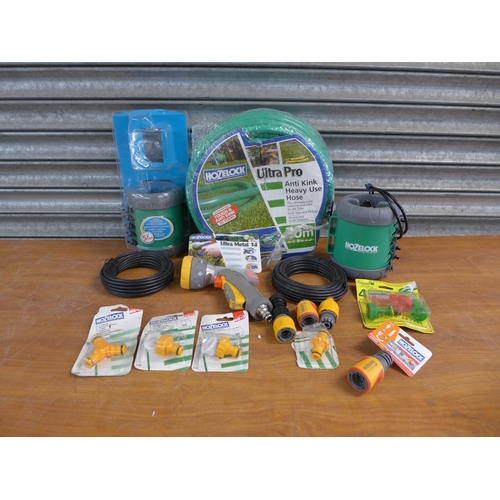 2203 - A quantity of Hozelock attachments and hose including connectors, spray guns, watering hose, etc.