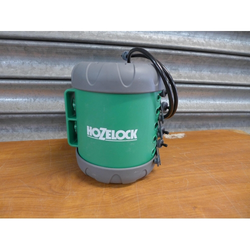 2203 - A quantity of Hozelock attachments and hose including connectors, spray guns, watering hose, etc.