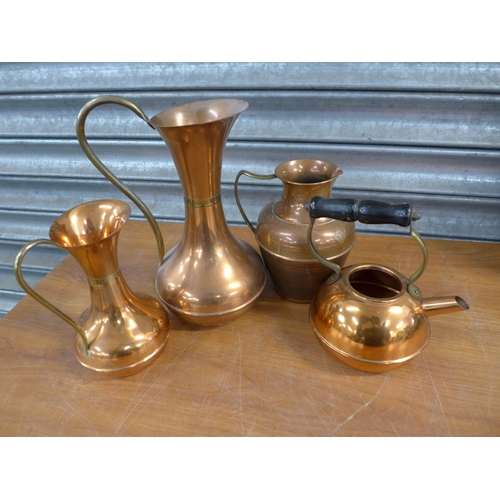 2218 - A large quantity of brass and copperware including jugs, candle holders, cups, teapots and other ite... 