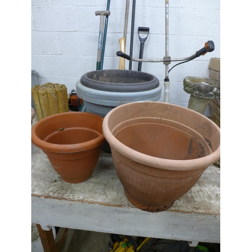 2222 - Four assorted plant pots containing an assortment of plants and shrubs