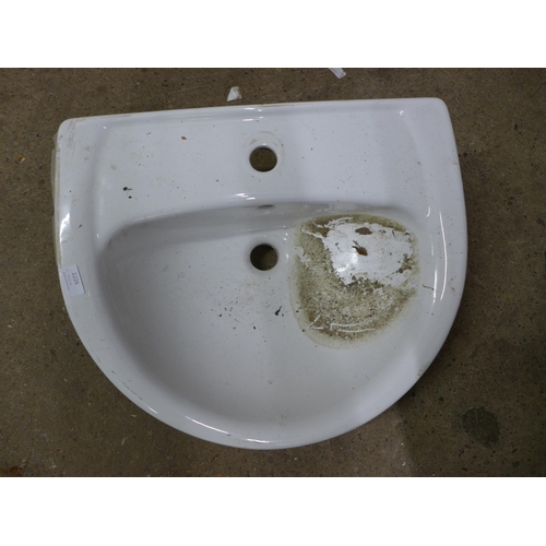 2226 - A used white ceramic hand wash basin